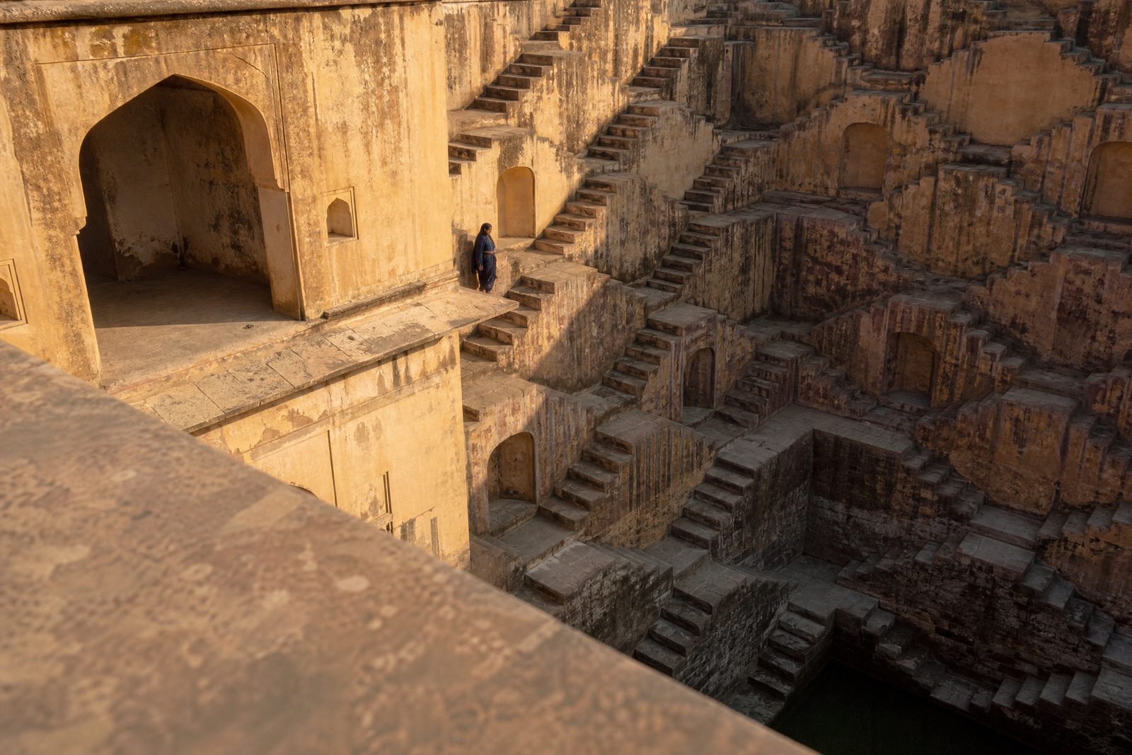 Geometric stone staircases inside a historic Rajasthan stepwell